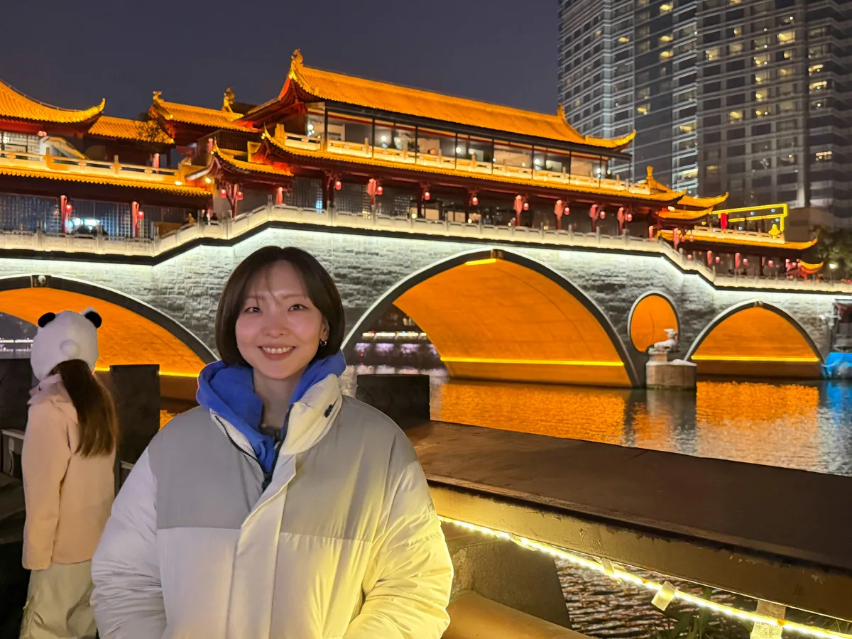 Anshunlang Bridge lit up at night over the Jinjiang River