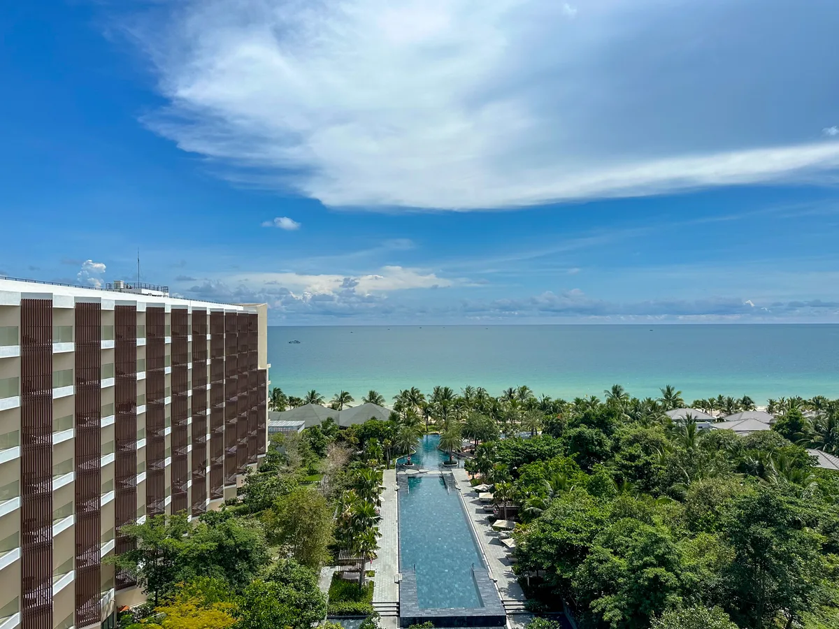 Balcony view of the infinity pool with ocean beyond at Crowne Plaza Phu Quoc