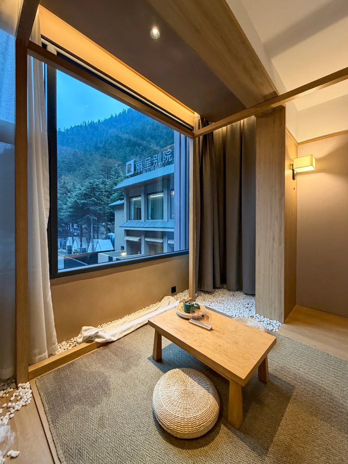 Tea corner by the window in a Zen Room at Jiuzhaigou Regent Retreat Hotel