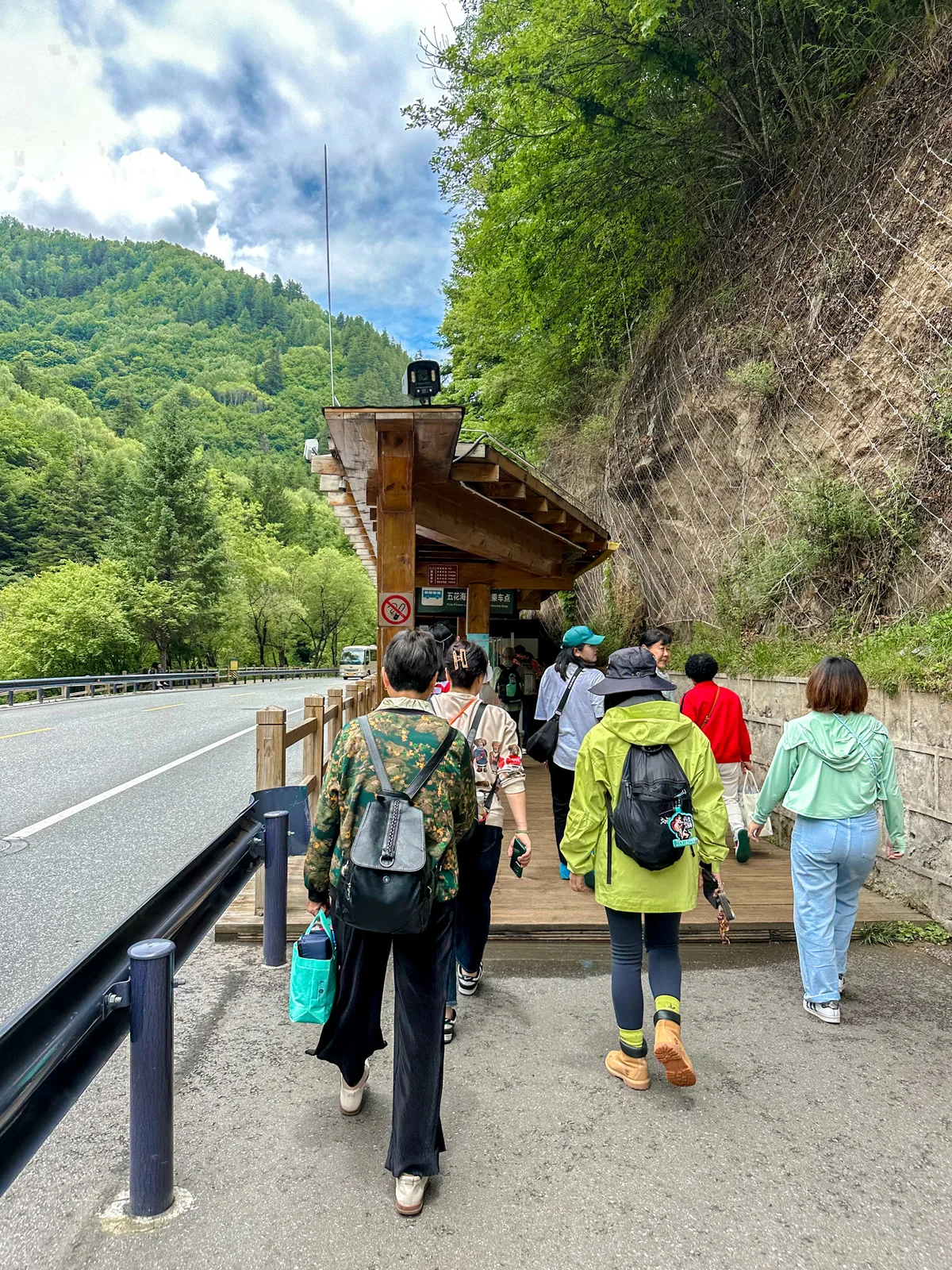 The Five-Flower Lake bus stop in Jiuzhaigou during a summer visit — one of the key seasonal considerations covered in these Jiuzhaigou travel tips