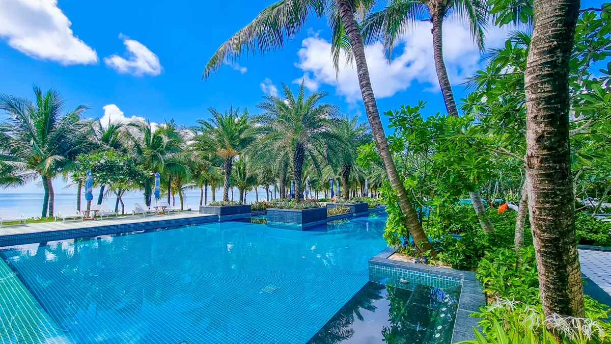 Sand Pool surrounded by palm trees at JW Marriott Phu Quoc