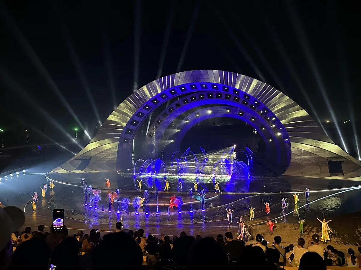 Dancers and illuminated fountains during the Kiss of the Sea show at Sunset Town, Phu Quoc