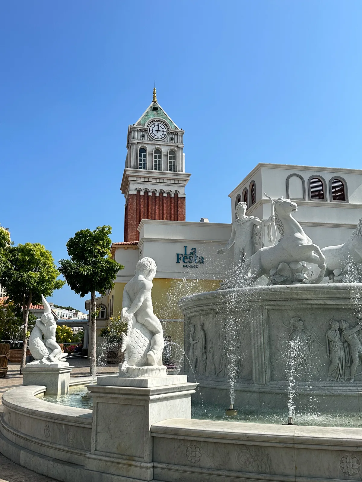 Marble fountain and clock tower at the entrance of La Festa Phu Quoc, Curio Collection by Hilton