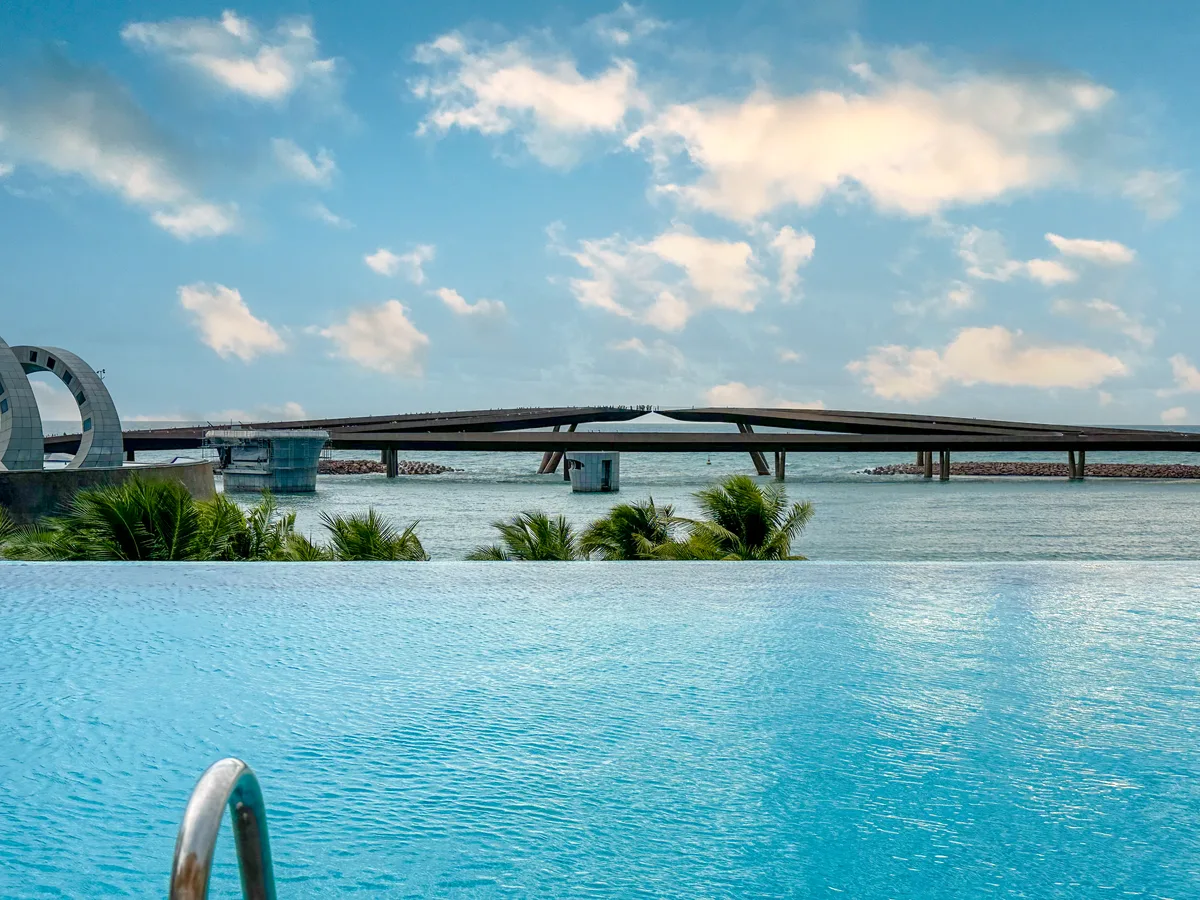 Heated infinity pool overlooking the Kiss Bridge at La Festa Phu Quoc
