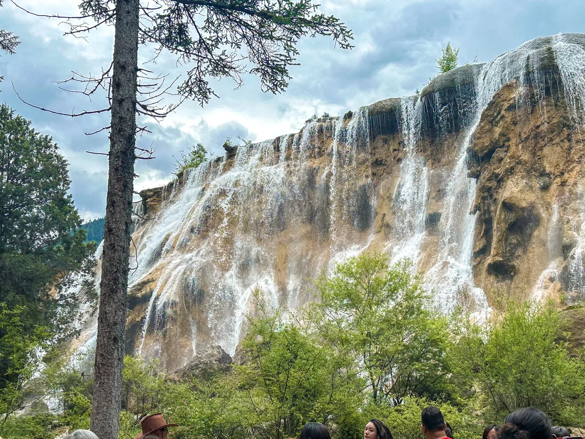 Wide view of Pearl Shoal Falls cascading over the rock face