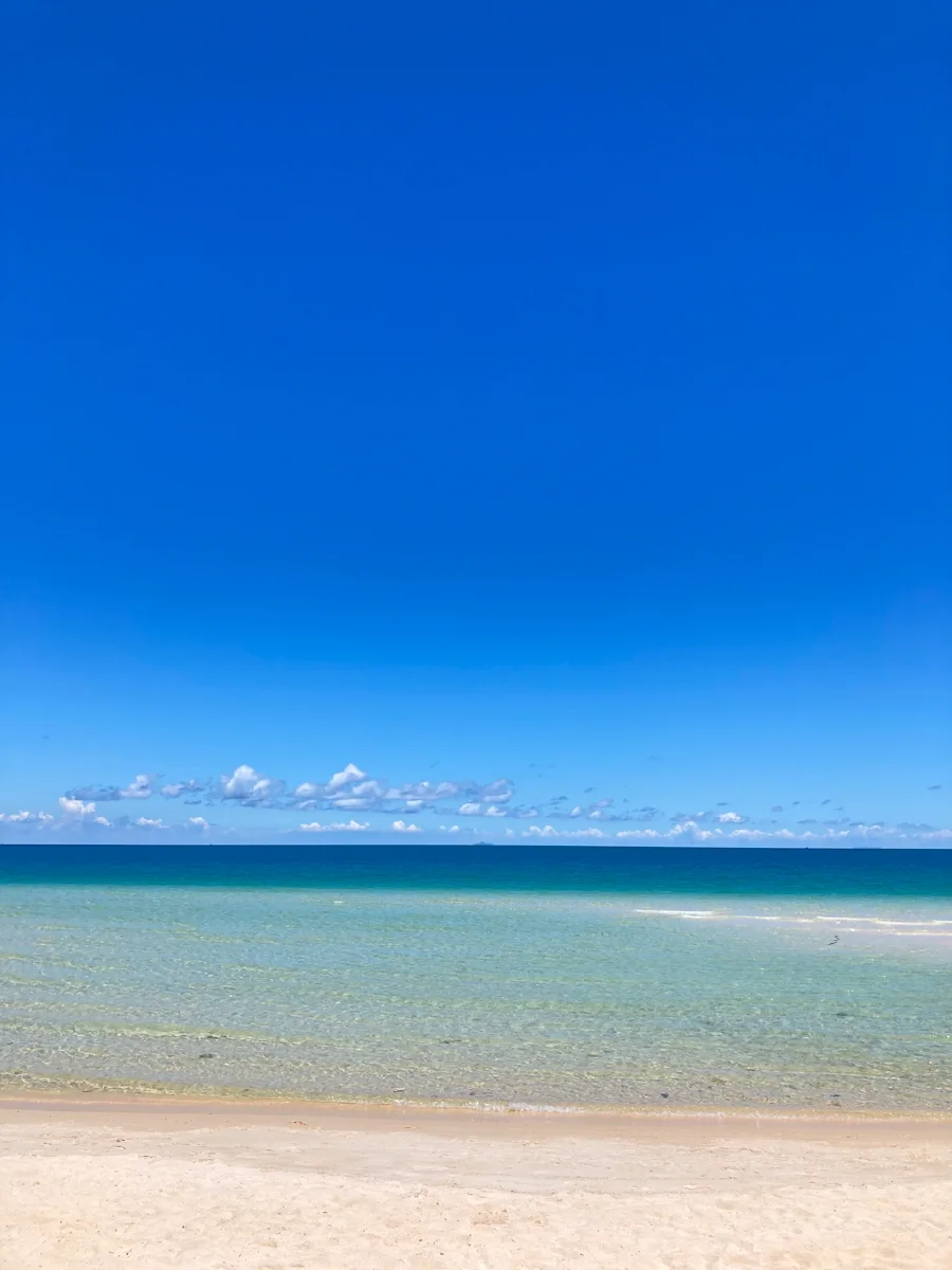 Clear shallow water and white sand at Khem Beach in front of Premier Residences Phu Quoc