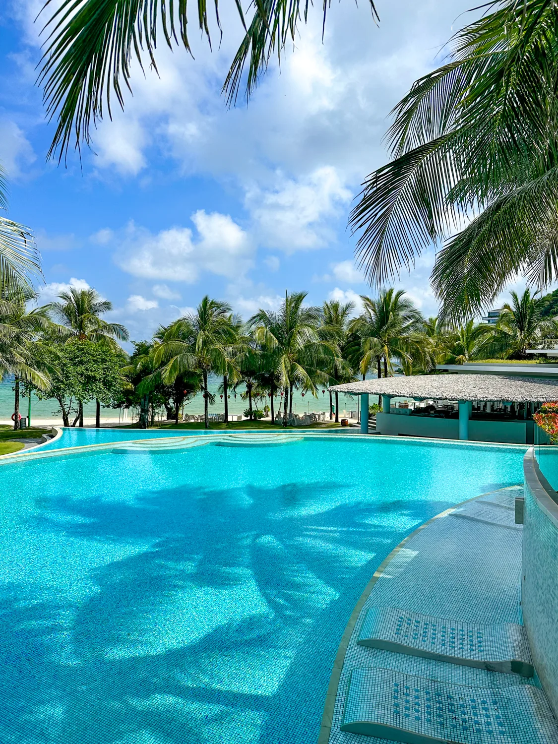Canal-style pool winding past resort villas at Premier Village Phu Quoc