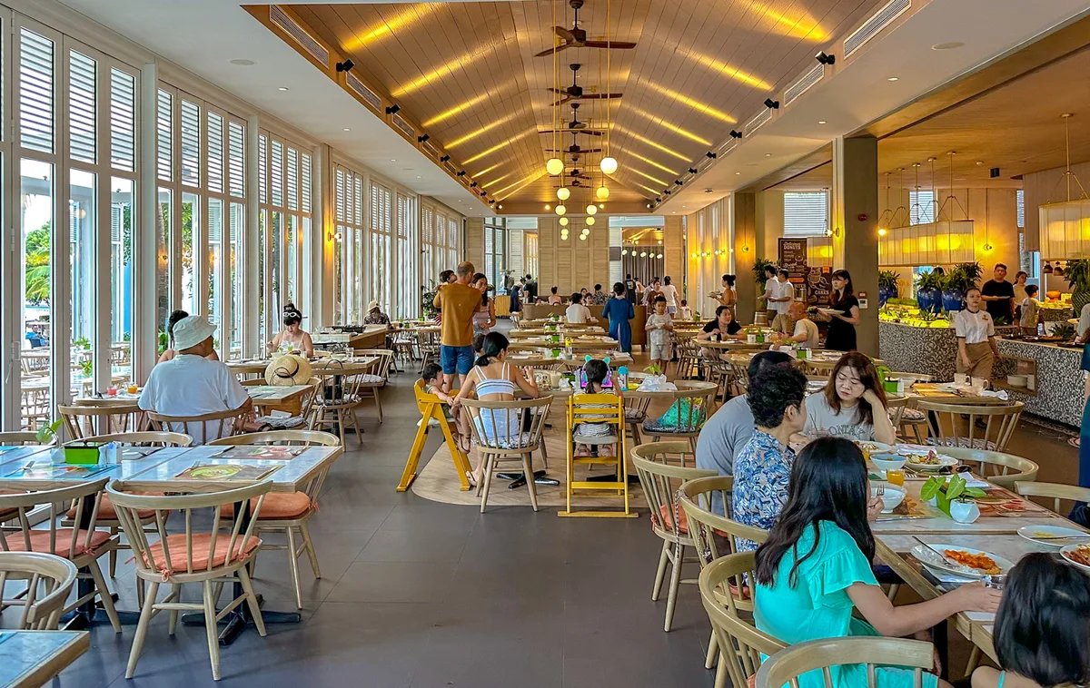 The Market restaurant dining hall with families and high chairs at Premier Village Phu Quoc