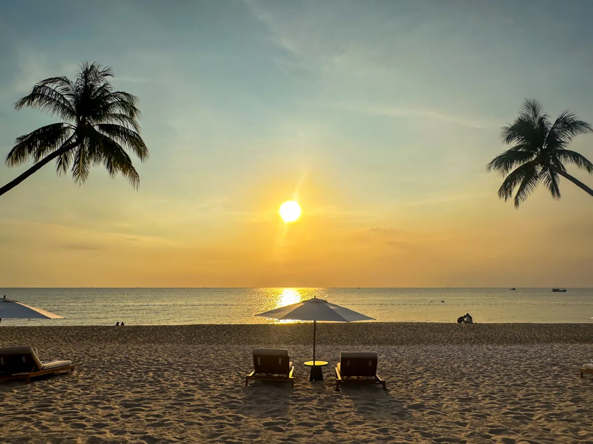 Beach loungers at sunset on Regent Phu Quoc's private beach