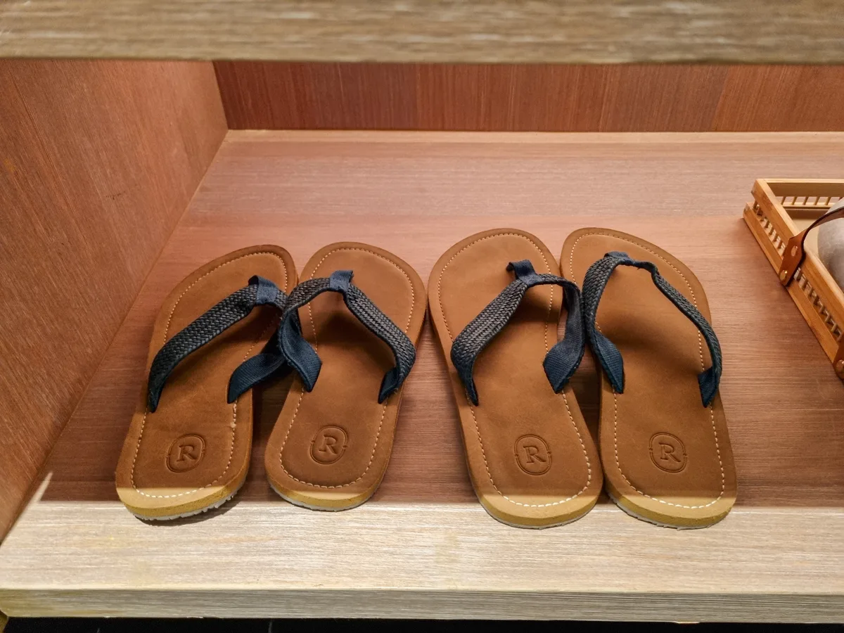 Regent-branded flip-flop sandals in a Regent Phu Quoc room closet