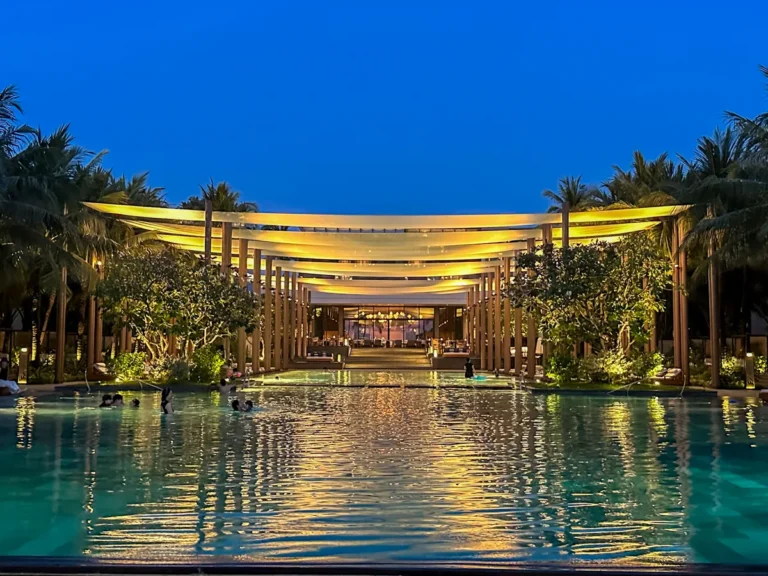 The Family Pool lit up in the evening at Regent Phu Quoc