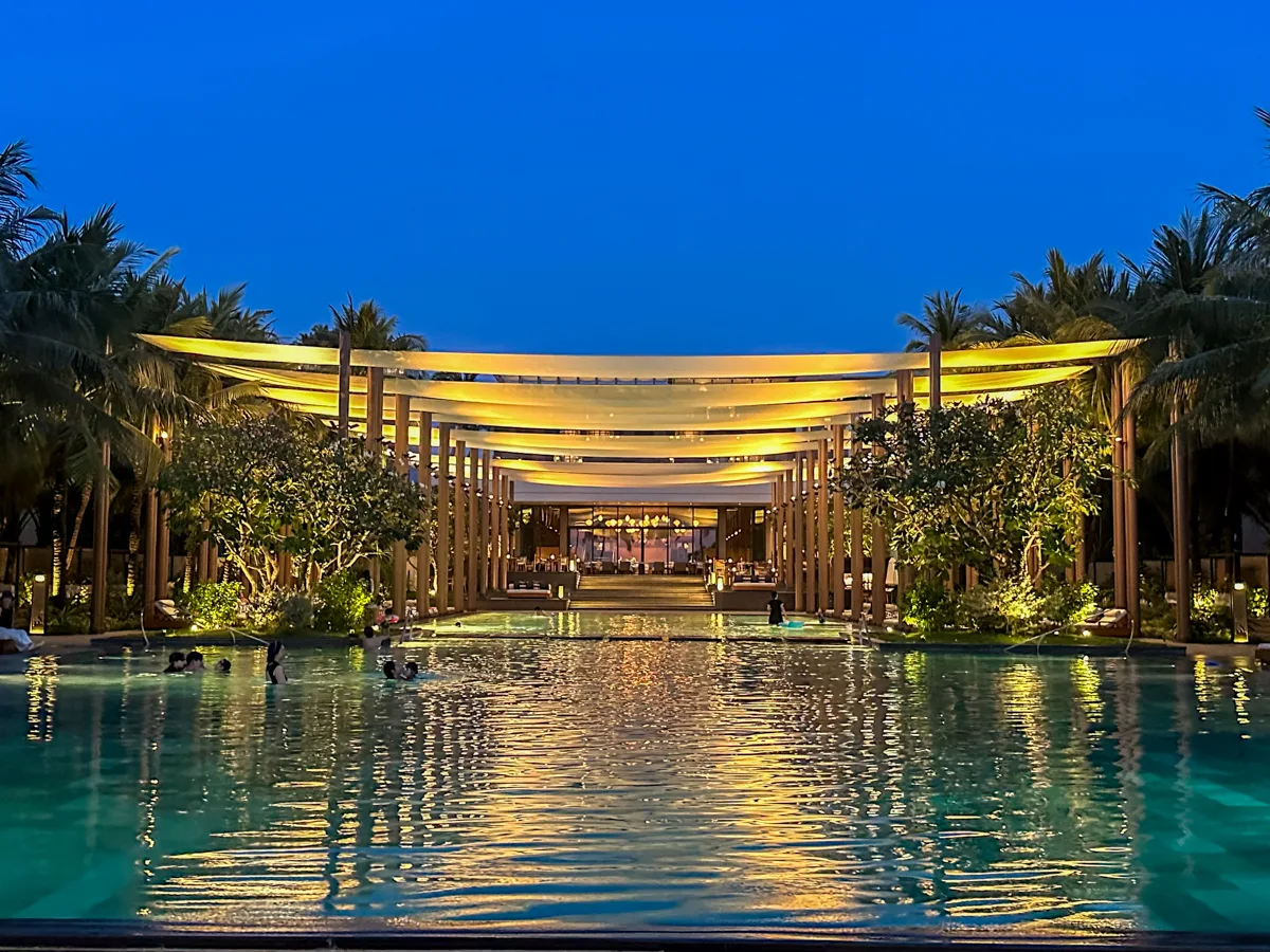 The Family Pool lit up in the evening at Regent Phu Quoc