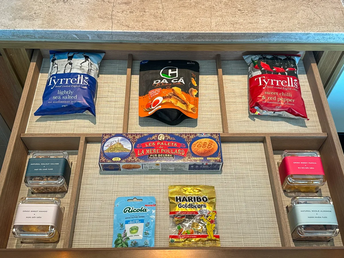 Fully stocked free minibar drawer with snacks and drinks at Regent Phu Quoc