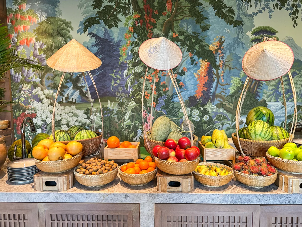 Fresh fruit station with conical hat displays at Rice Market, Regent Phu Quoc