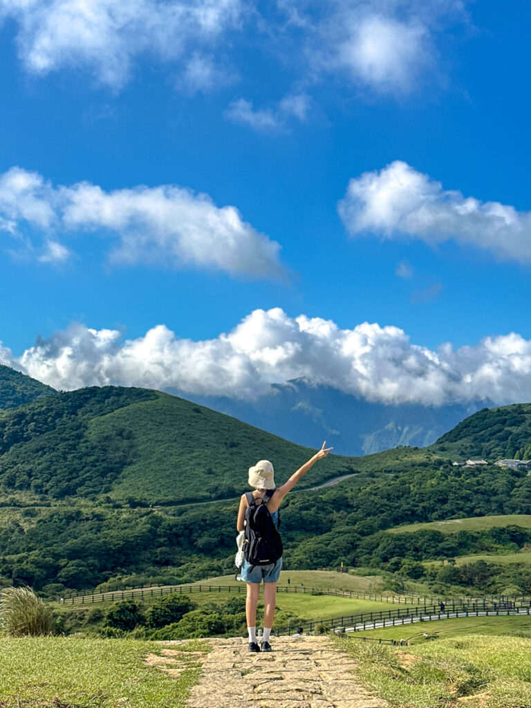 Yuri overlooking Qingtiangang Grassland in Yangmingshan, Taiwan