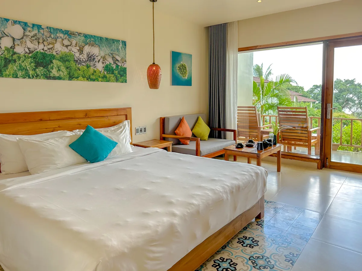 A cozy, secure-feeling hotel room in Phu Quoc with a balcony view