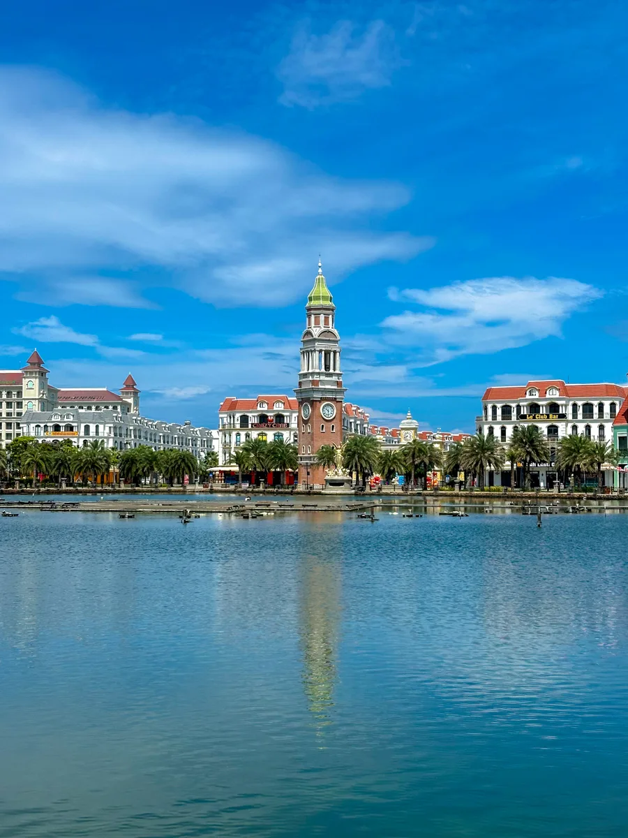 Grand World's clock tower reflected in the water in Phu Quoc