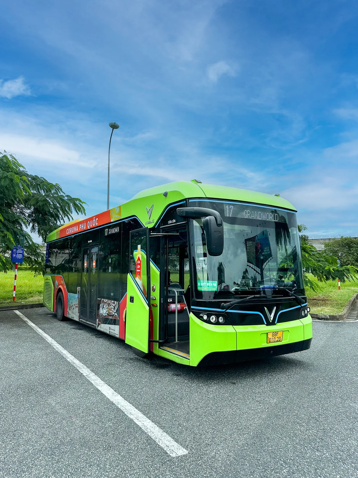 Green Vin Bus route 17 to Grand World parked at a Phu Quoc bus stop