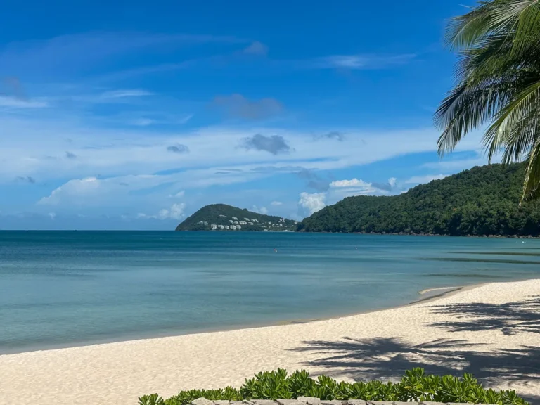 Calm, glassy emerald water under a clear sky on Phu Quoc during dry season