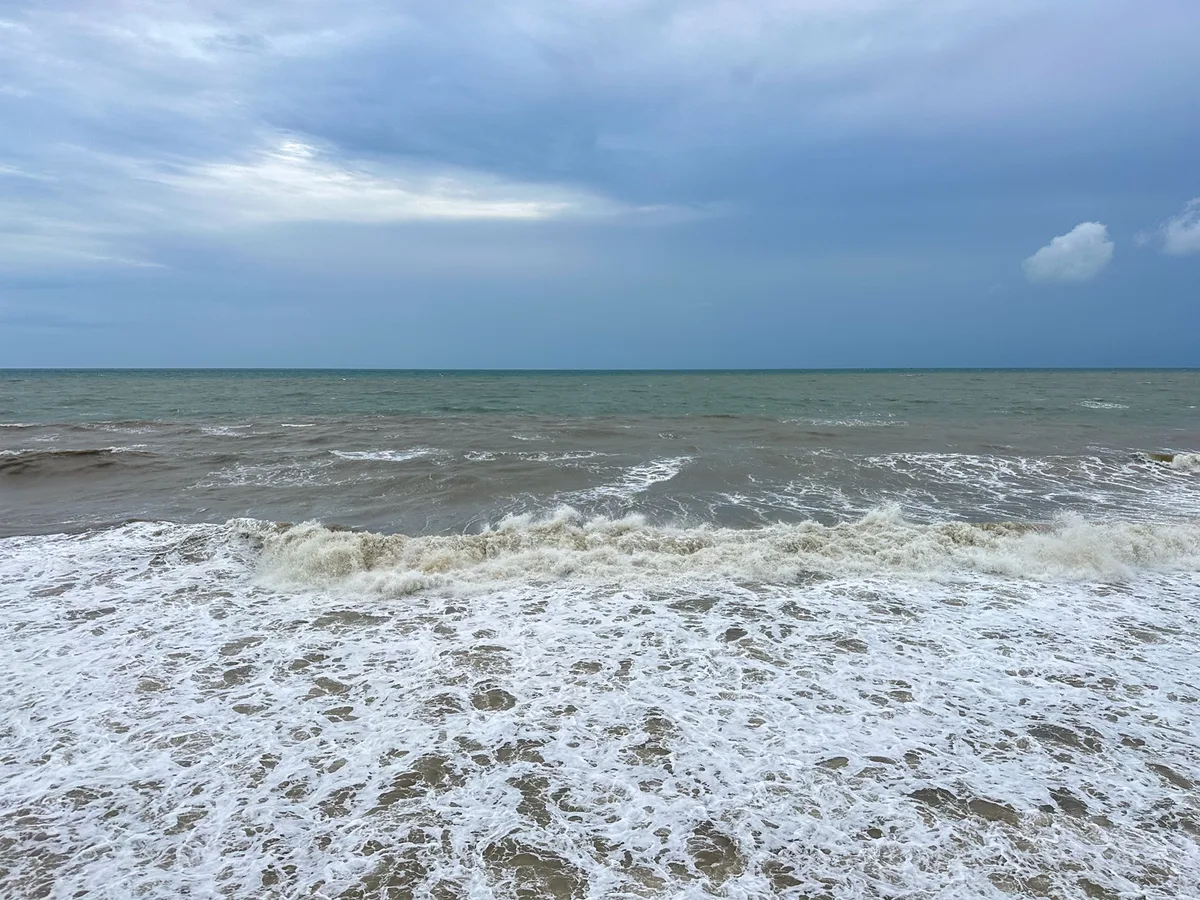 Rough waves rolling in under an overcast sky during Phu Quoc's rainy season